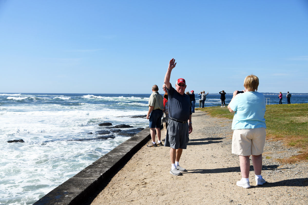 257 Dick Luethje waves as others enjoy the crashing waves at Brenton Point.jpg